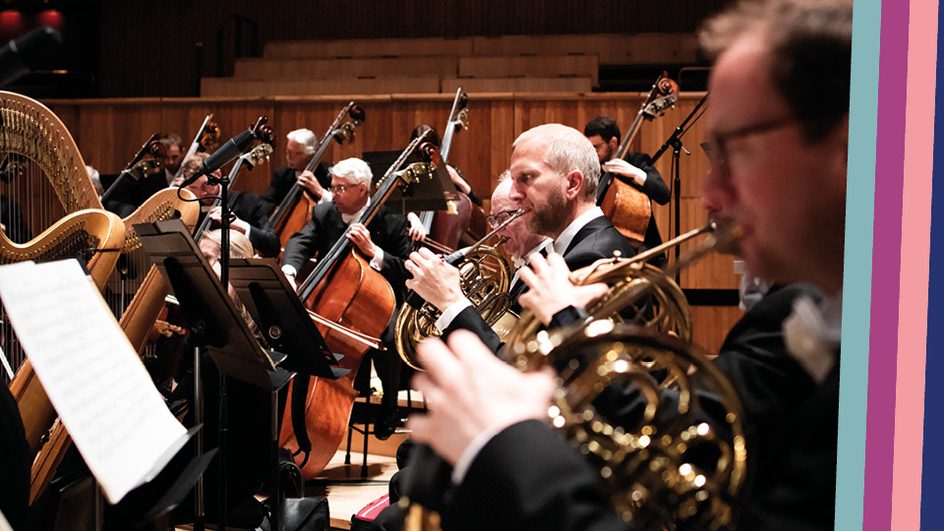 Close up of orchestra players on stage, brass and string section