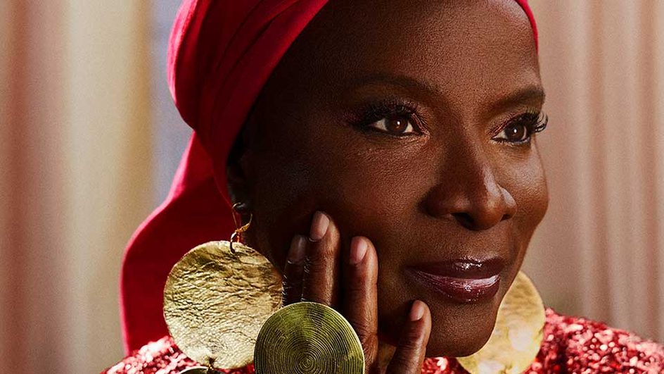 Angelique Kidjo with hand on her face