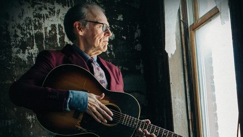 John Hiatt with an acoustic guitar