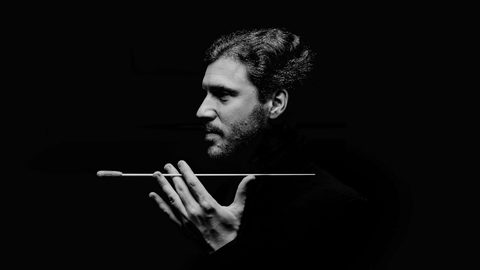 Stanislav Kochanovsky conductor. black and white with baton